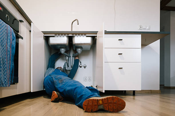 Professional Plumbing technician working in Van Lear, KY